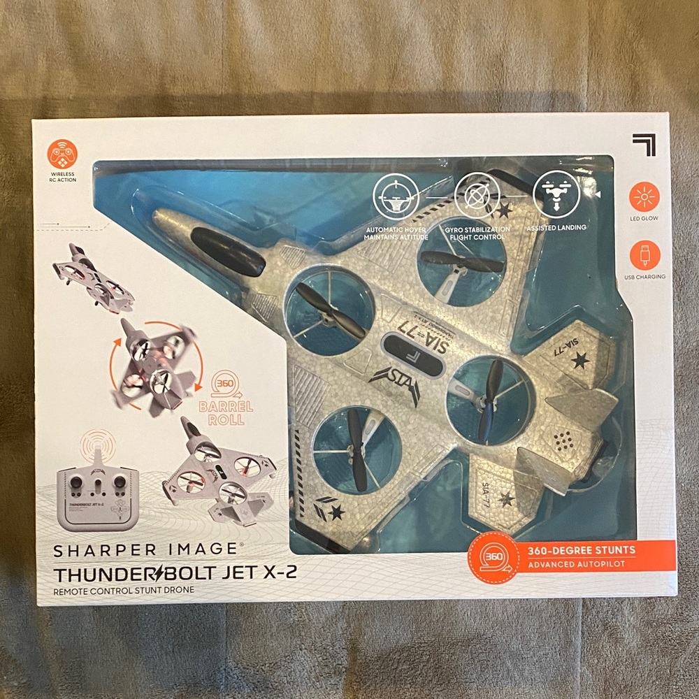 NEW IN BOX Sharper Image Thunderbolt Jet X-2 Remote Stunt Drone - Silver